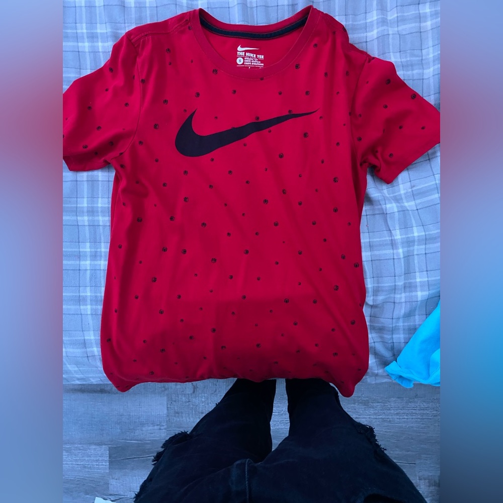 red nike shirt with tiny basketball designs